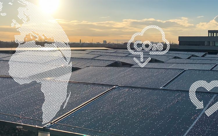 Solar panels on the roof of a building in the city. Graphic elements as additional layer: globe, CO2e reduction and a heart.