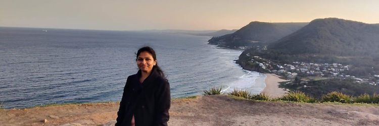 Vidula K in front of a cliff