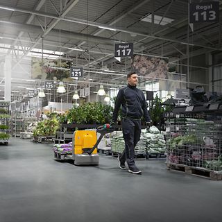 Man with an AME 18 in a warehouse