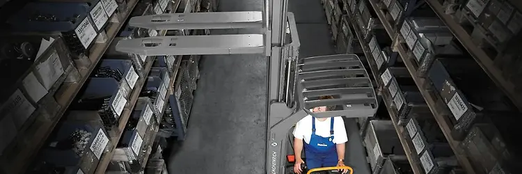 Stand-on Reach Truck vs. Electric Ride-on Stacker